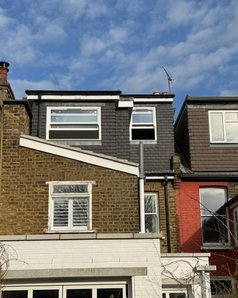 Loft conversion completed by J2 Build featuring new dormer windows, modern cladding, and upgraded roof structure on a North London property.